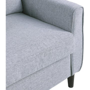 Close-up of button-tufted detail on grey backrest cushion