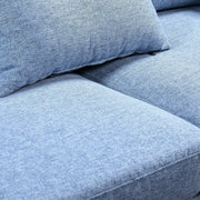 Close-up of blue linen fabric texture on seat cushion