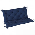 Dark blue tufted two-seater bench cushion with tie fastenings, studio shot with no frame
