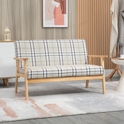Check pattern 2 seater sofa in a living room beside a rug and wood panelling