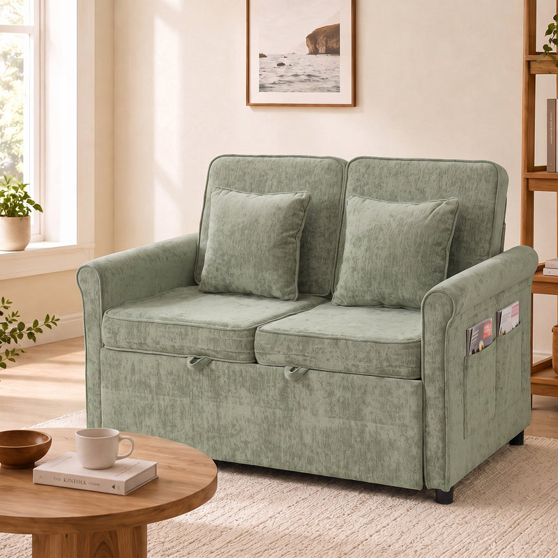 Front view of the closed sofa with two cushions and items tucked in the arm pocket