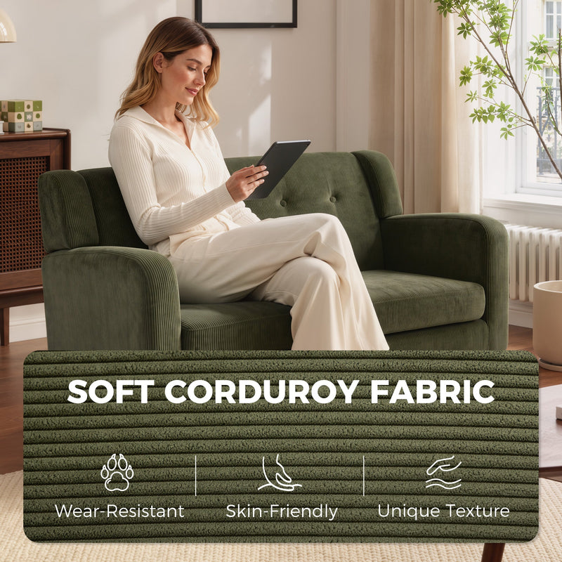 Woman sitting on the loveseat sofa using a tablet