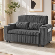 Dark grey corduroy sofa bed in a living room, front angle view with side pocket