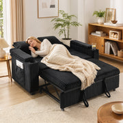 Woman sleeping on the black sofa bed pulled out into bed mode with a throw blanket