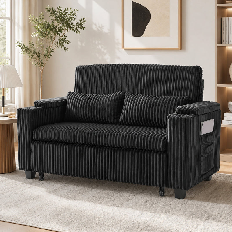 Black corduroy sofa bed in a living room, front angle view with side pocket