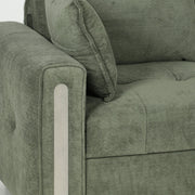 Close-up of the sofa armrest with a contrast trim panel and scatter cushion