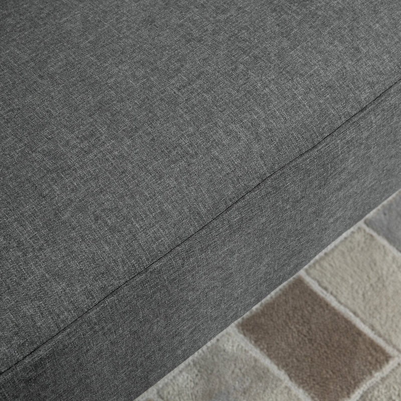 Close-up of the grey linen-look sofa fabric and seam