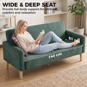 Woman reading on the sofa showing the 140cm wide, 51cm deep seat