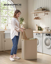 Open lid showing the two compartments inside the laundry basket