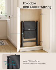 The 2-step ladder folded to 5.2 cm thick and stored upright inside a kitchen cupboard