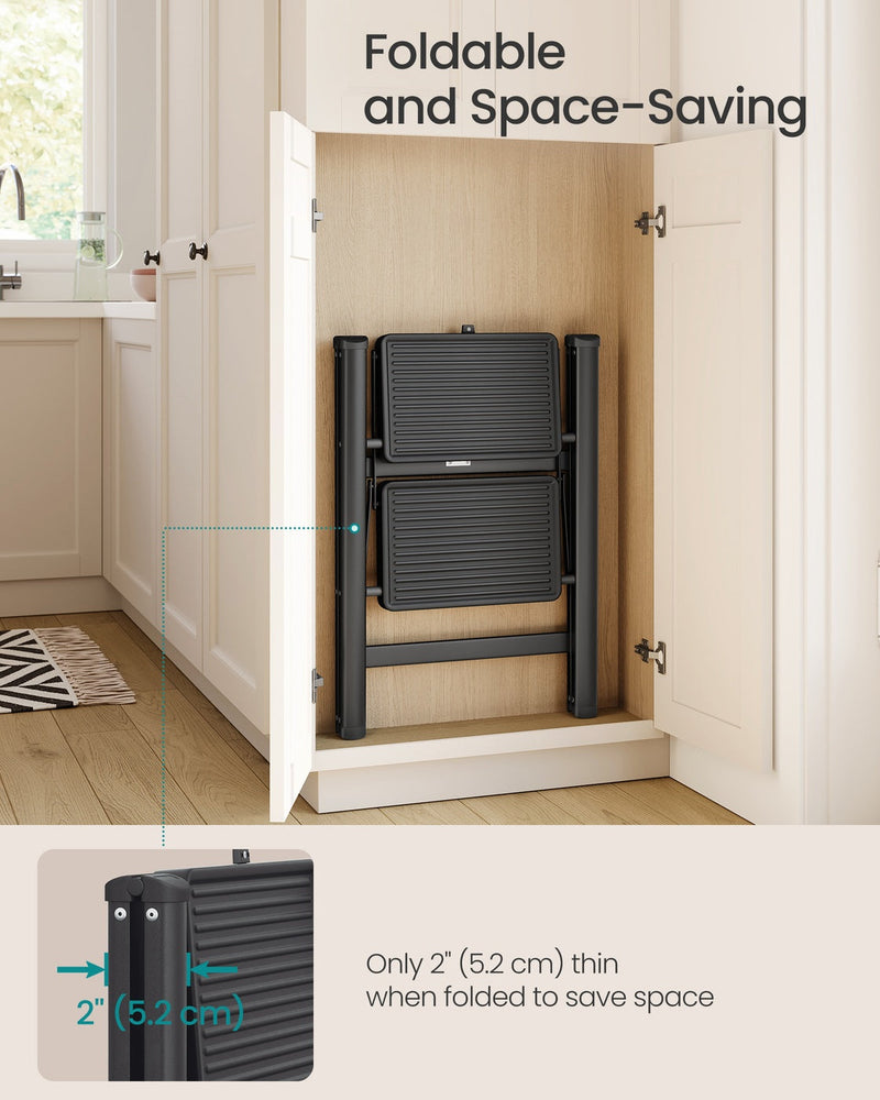 The 2-step ladder folded to 5.2 cm thick and stored upright inside a kitchen cupboard