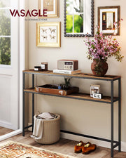 Console table against a hallway wall below framed pictures with flowers and a radio on top