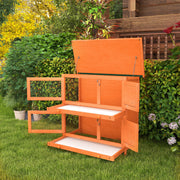 Hutch shown outdoors with roof lifted open and trays pulled out in a garden setting