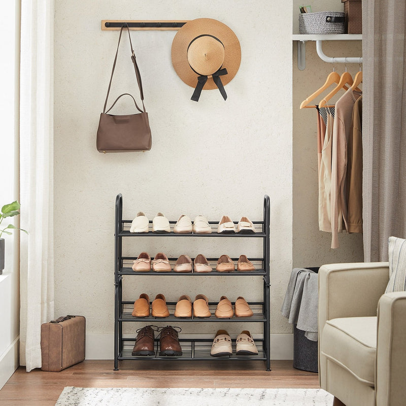 Two 2 tier shoe racks stacked into a 4 tier unit beside hanging clothes
