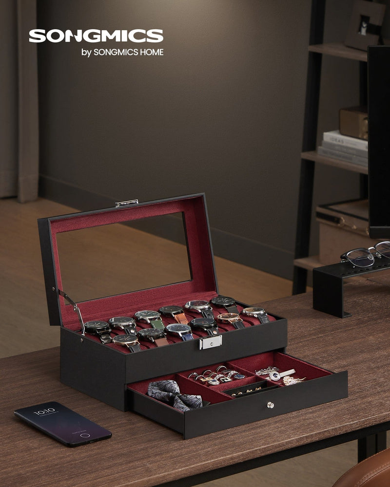 Songmics 2-tier watch box open on a wooden desk with the lower jewellery drawer pulled out