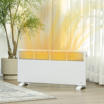 White convector heater beside sheer curtains, warm glow showing heat rising from the front vents