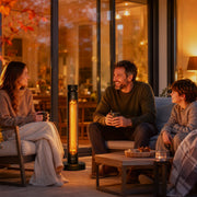 Black patio heater warming a family seated around an outdoor coffee table