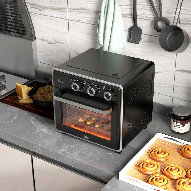 Black Homcom convection oven on a kitchen counter baking cinnamon rolls