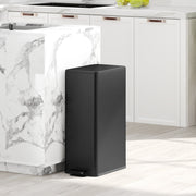 Black 20L slim stainless steel pedal bin beside a marble-topped kitchen island