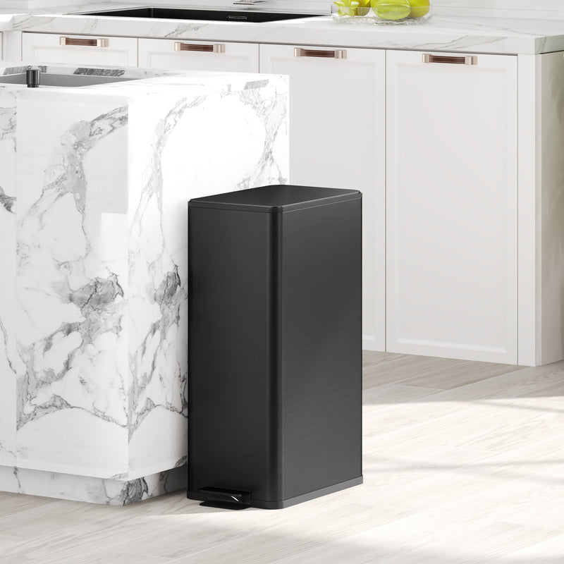 Black 20L slim stainless steel pedal bin beside a marble-topped kitchen island
