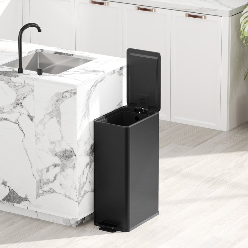 Black 20L slim stainless steel pedal bin with the lid open beside a kitchen island