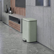 20L pedal bin standing beside a TV unit in a living room