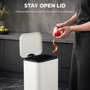 Stay-open lid graphic with a person peeling an apple over an open pedal bin