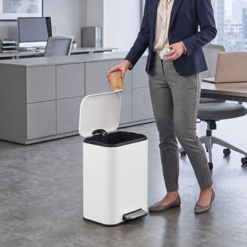 Woman in an office dropping a cup into an open 20L pedal bin