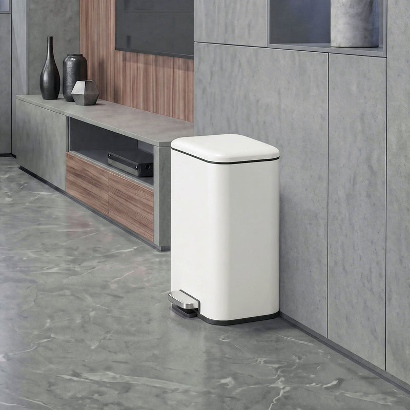 20L pedal bin standing beside a TV unit in a living room