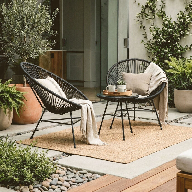 Black rattan 3 piece bistro set styled on a patio