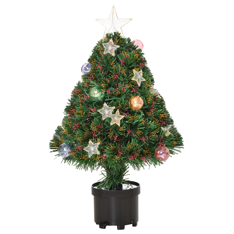 Tabletop tree decorated with red berries, stars and baubles in a black pot on a white background