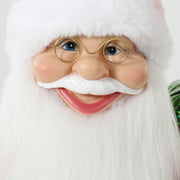 Close-up of Santa's face with gold glasses and white beard