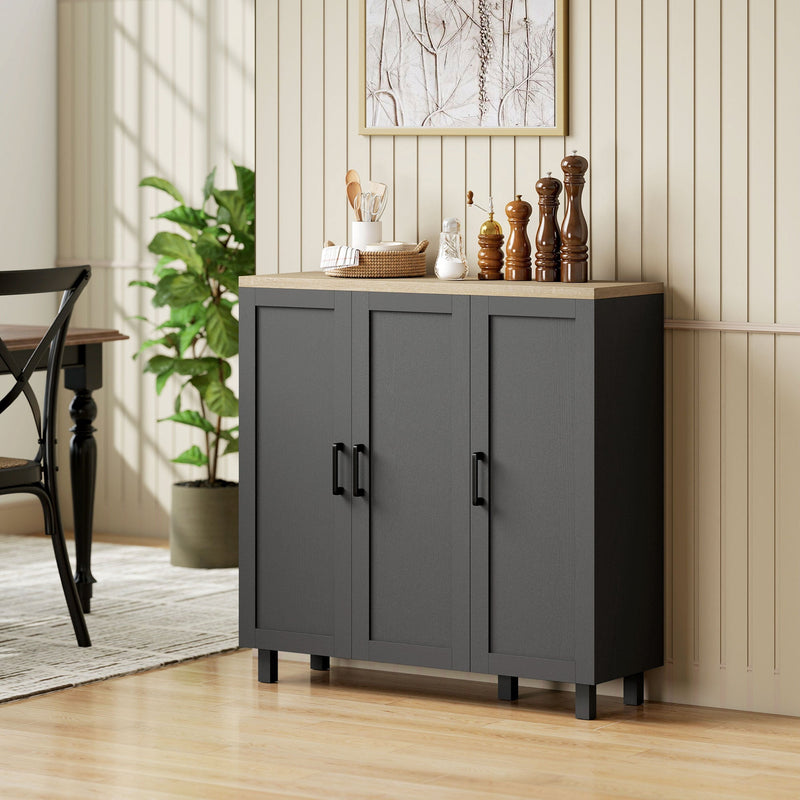 Black sideboard buffet cabinet styled in a dining nook with kitchen jars and utensils on top