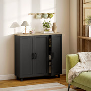Black sideboard buffet cabinet styled in a living room beside a sofa and side table