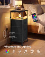 Ink black bedside table in a bedroom with a phone app being used to change the LED light colour