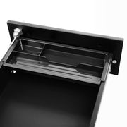 Top drawer open showing the compartment tray and the lock bar inside