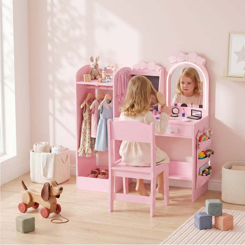 Girl brushing her hair at the pink 3-in-1 kids dressing table