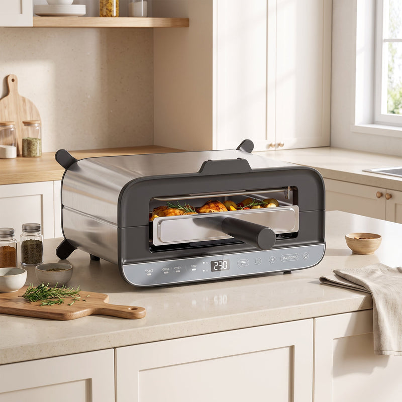 Mini oven on a kitchen worktop in oven mode roasting chicken and vegetables