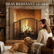 Heat resistant guard panel showing the screen shielding a woman and dog from the fire