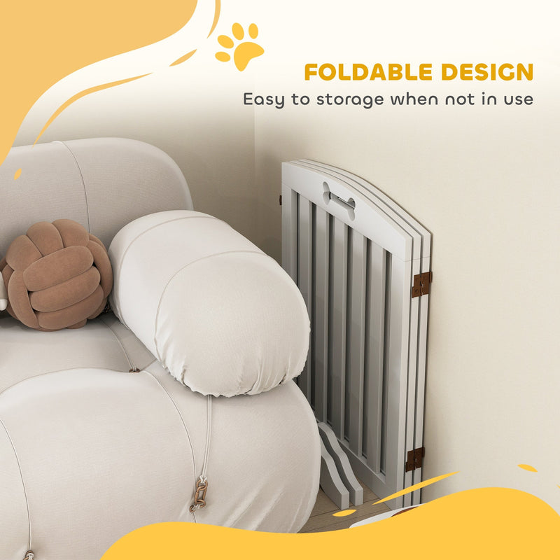 Dog gate folded flat and tucked beside a sofa, showing the foldable storage design