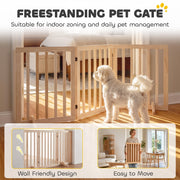 Freestanding pine dog gate being carried and placed against a wall, showing the wall-friendly and easy-to-move design
