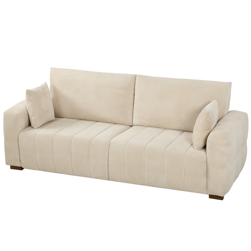 Cream white 3 seater velvet sofa with 2 pillows on a plain white background