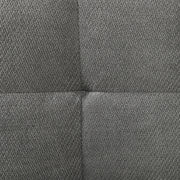 Close-up of the grey textured sofa fabric showing the panel seam
