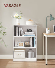 Bookcase styled with books and plants in a living room