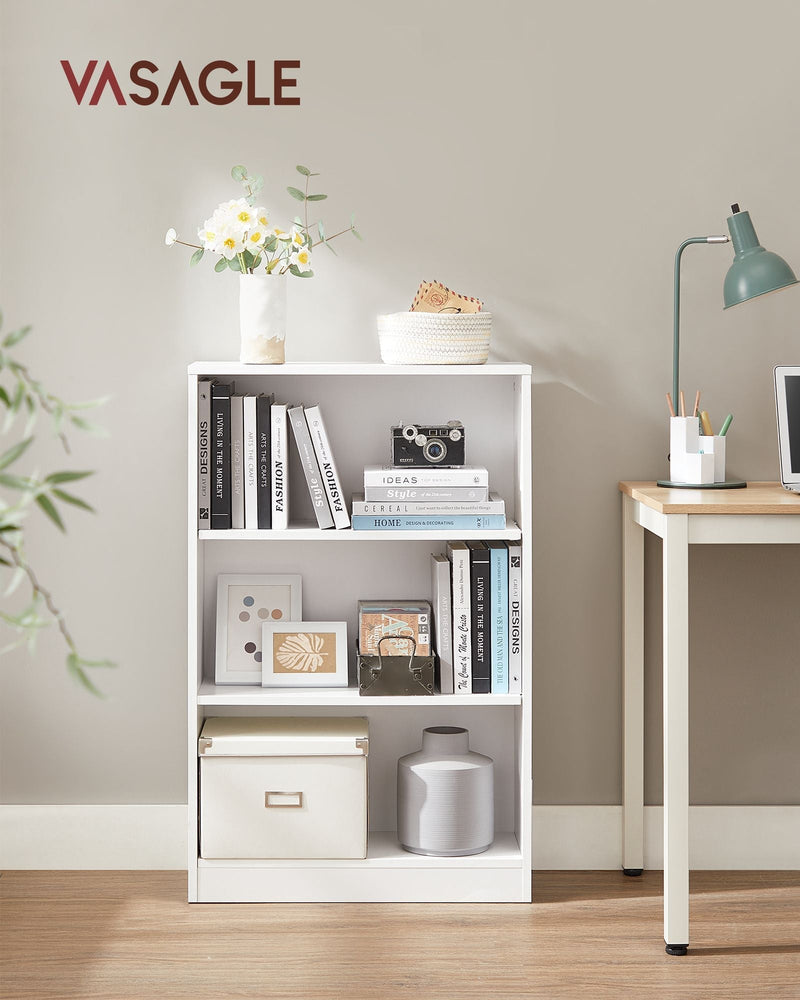 Bookcase styled with books and plants in a living room