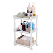 White 3-shelf plastic storage trolley on castors holding toiletries and folded towels