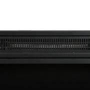 Close-up of the black vent grille along the top of the electric fire