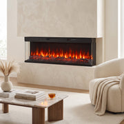 Electric fire insert set into a plaster wall beside an armchair and a vase