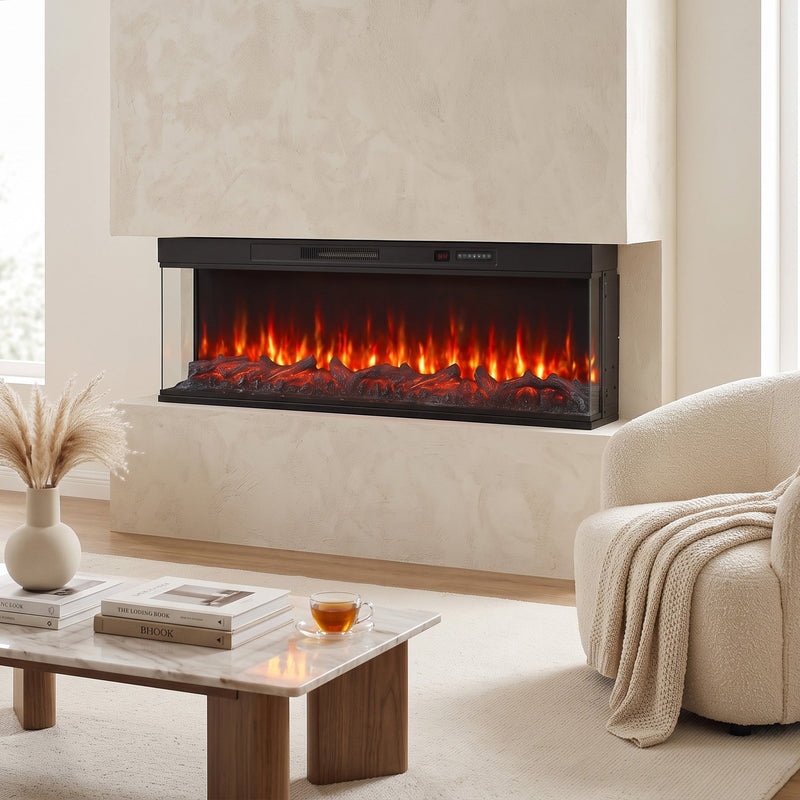 Electric fire insert set into a plaster wall beside an armchair and a vase