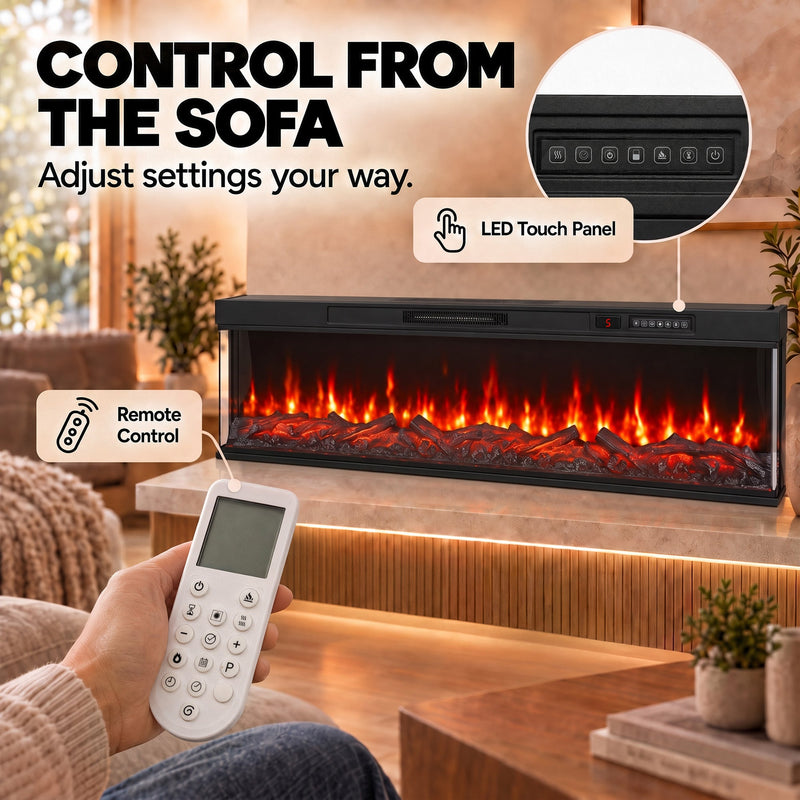 Hand holding the remote beside the LED touch panel close-up on the electric fire